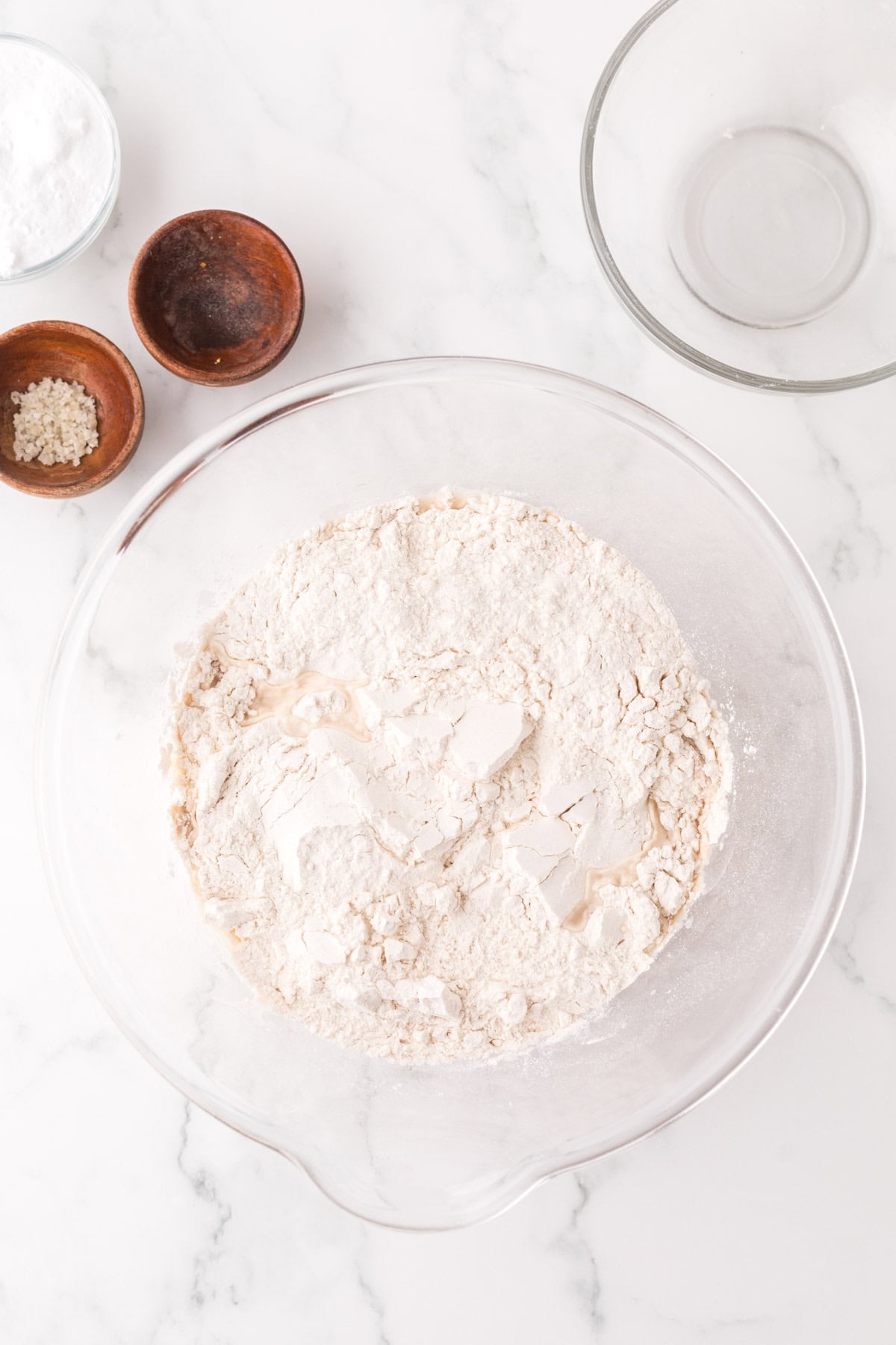 clear mixing bowl in the process of making big soft pretzels.