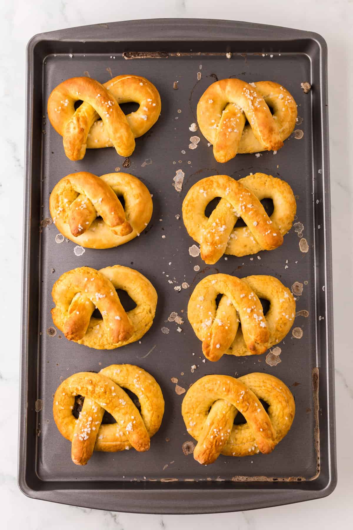 baking dish with big soft pretzels fresh from the oven.