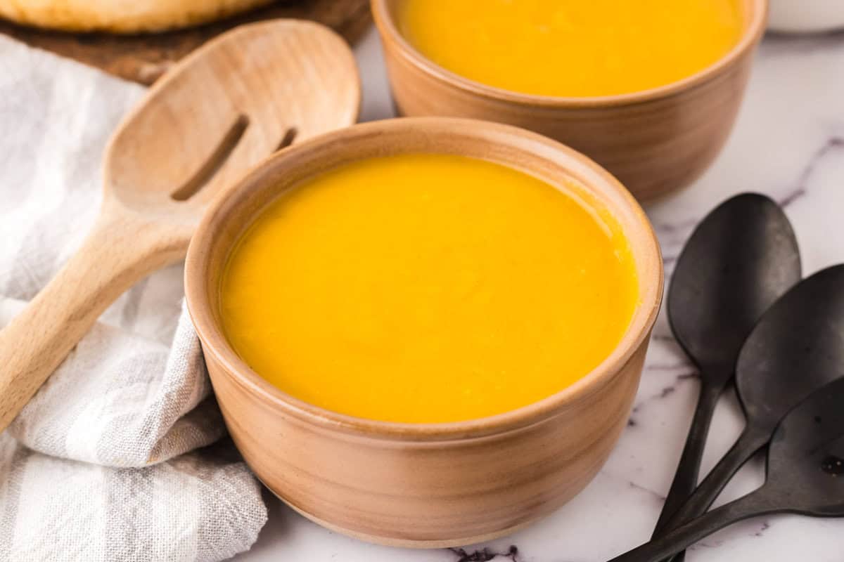 homemade butternut squash soup in two serving bowls.