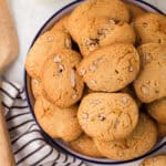 honey pecan sliced cookies stacked on a round plate.