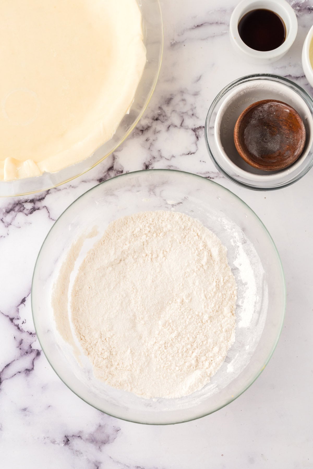 clear mixing bowl in the process of making hoosier sugar cream pie.