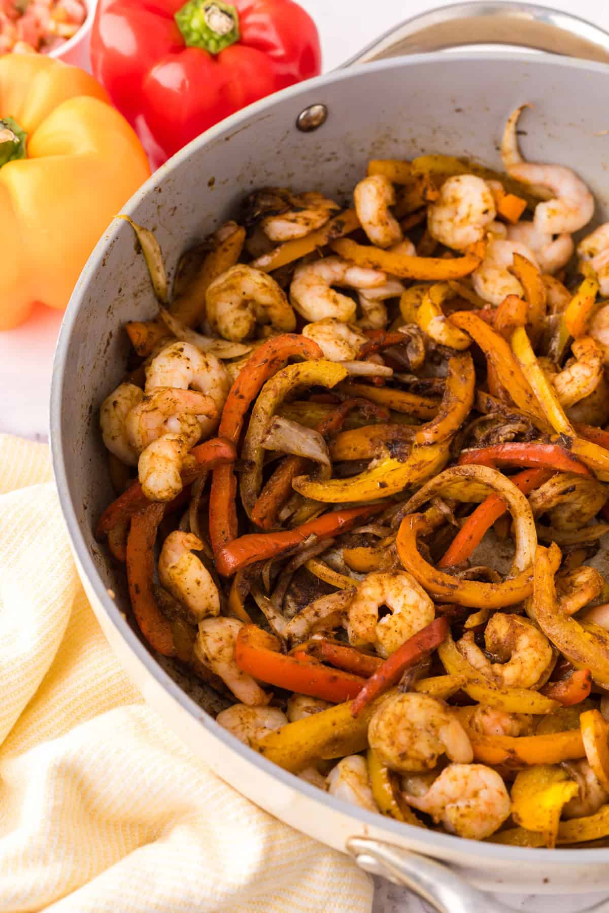 Shrimp Fajitas in a pan in the process of cooking.