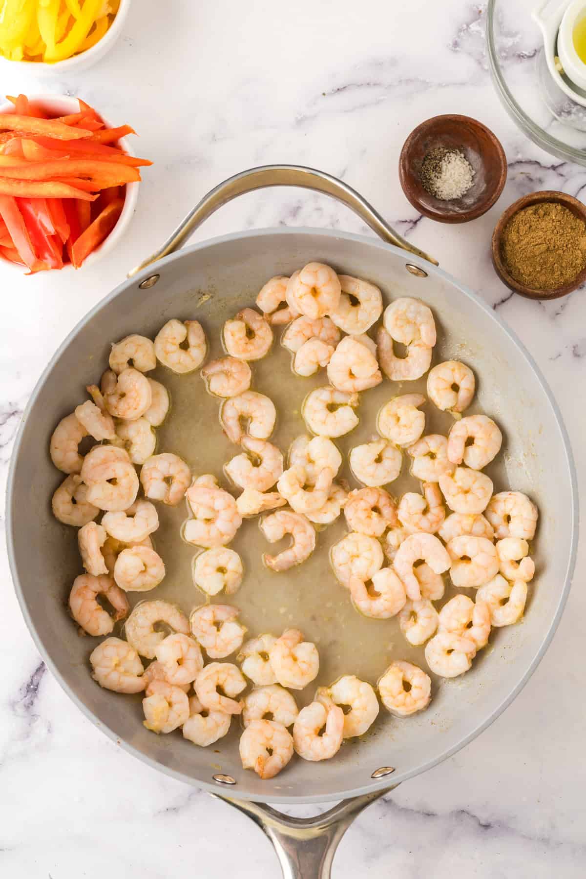 Shrimp Fajitas in a pan in the process of cooking.