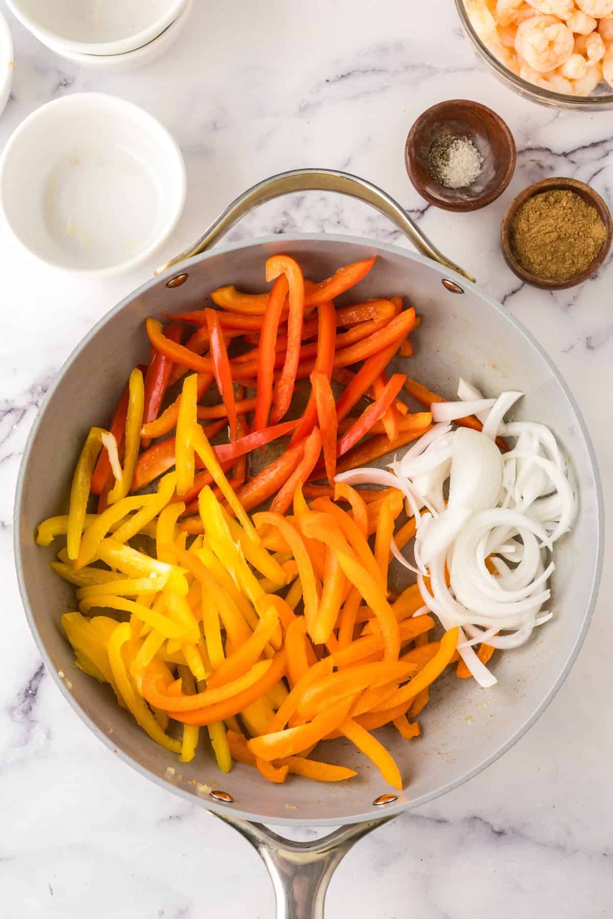 Shrimp Fajitas in a pan in the process of cooking.