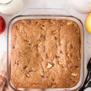 whole apple cake recipe in a glass pan.