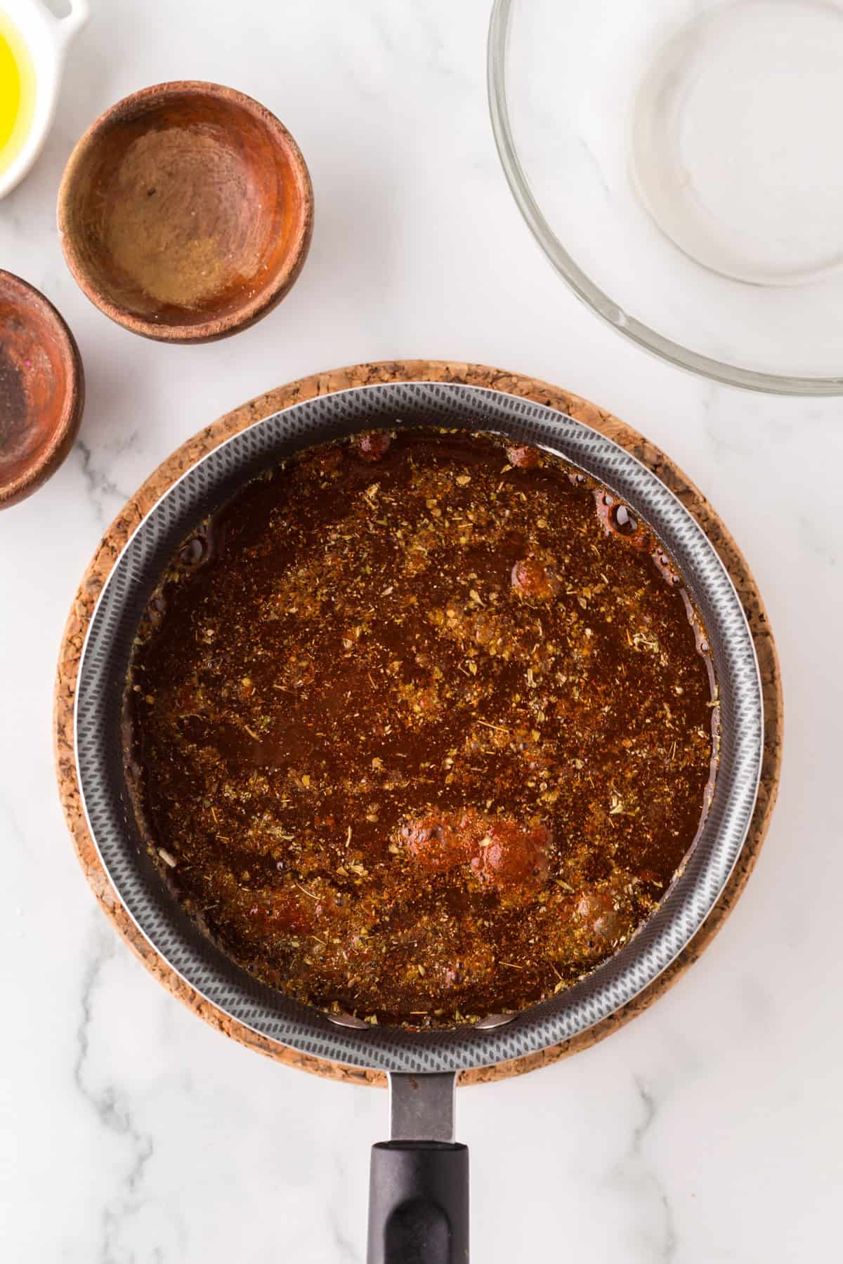 the process of making red enchilada sauce.