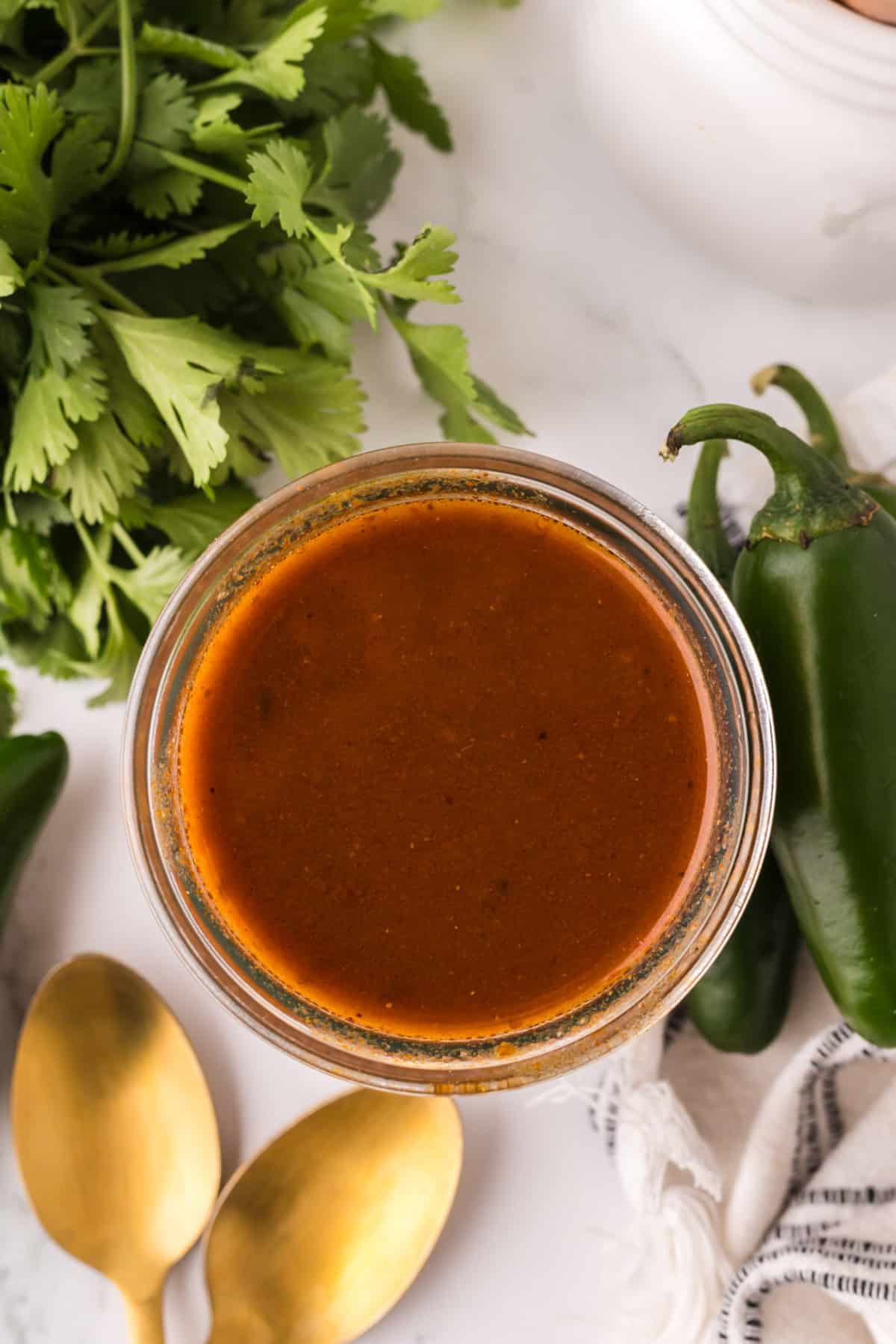 red enchilada sauce in a glass dish.