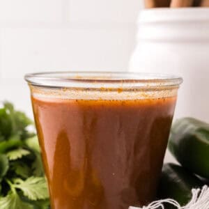 red enchilada sauce in a glass dish.