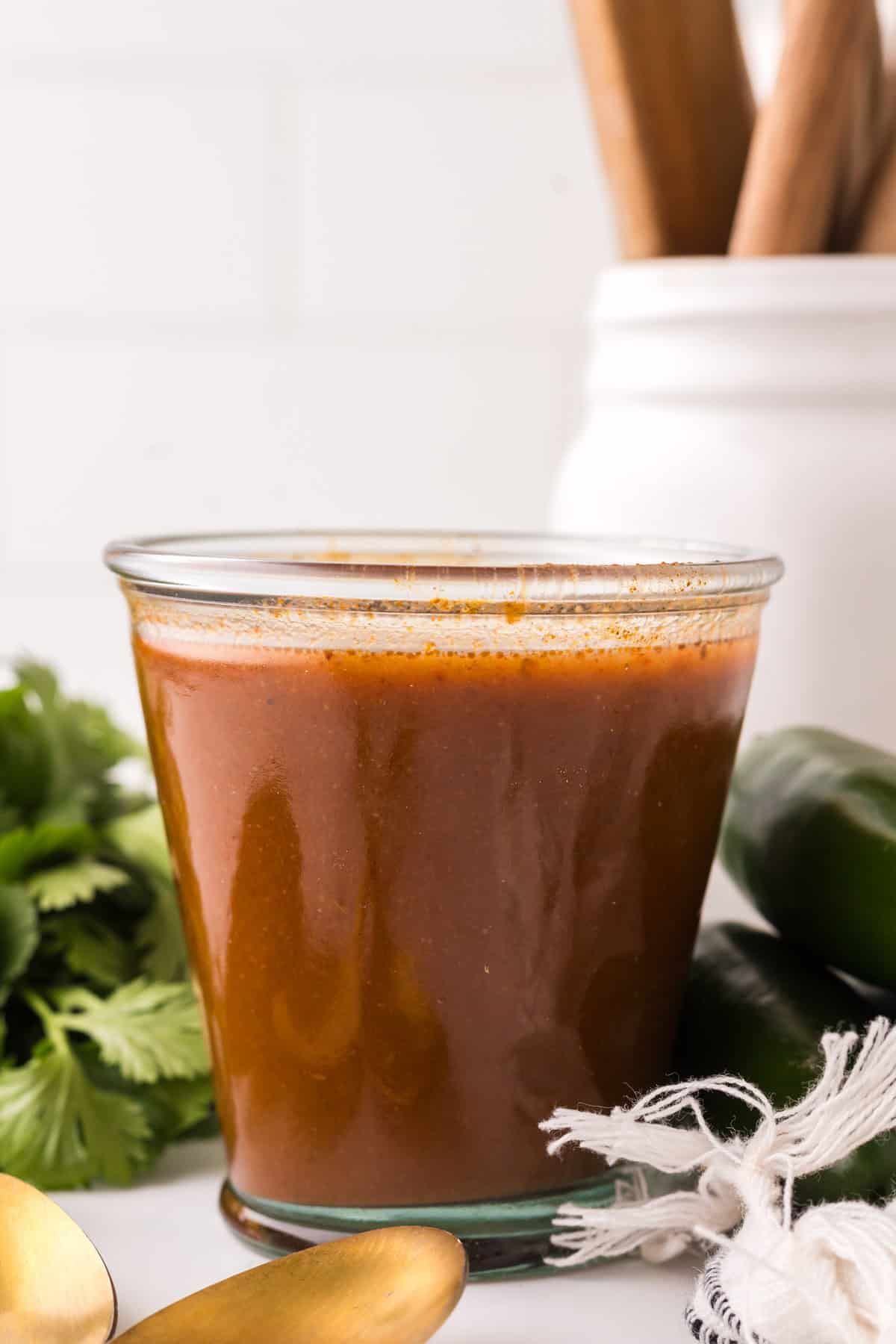 red enchilada sauce in a glass dish.