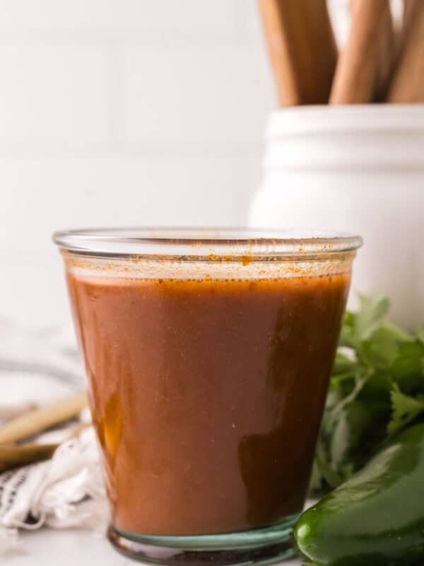 red enchilada sauce in a glass dish.