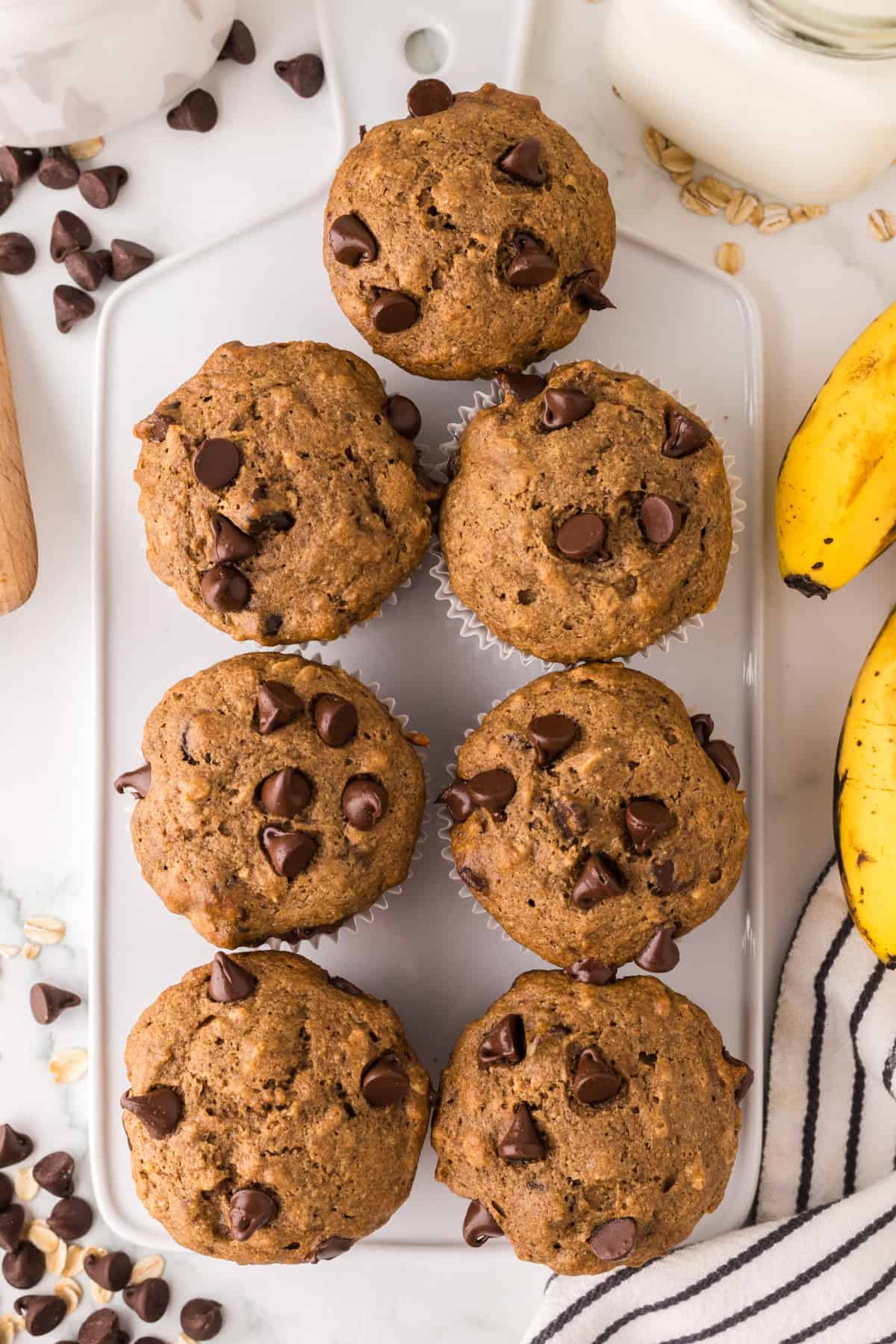 healthy banana muffins on a white cutting board.