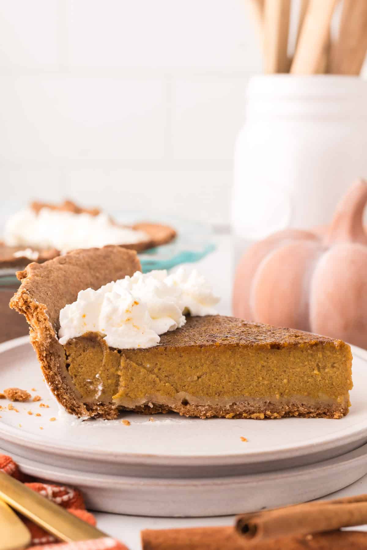 one slice of healthy pumpkin pie on a round plate.