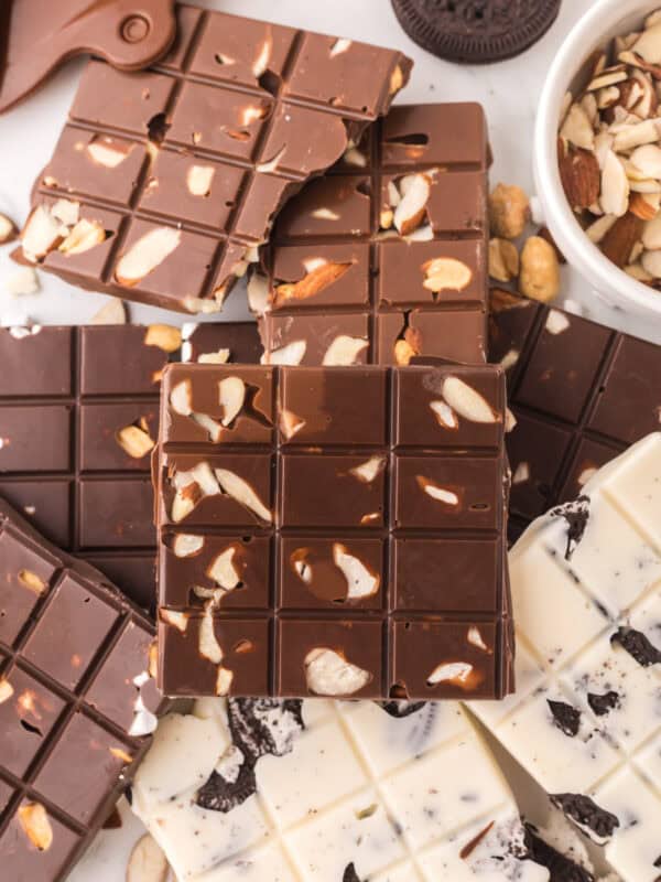 homemade candy bars with white chocolate and milk chocolate with nuts and oreo cookies.