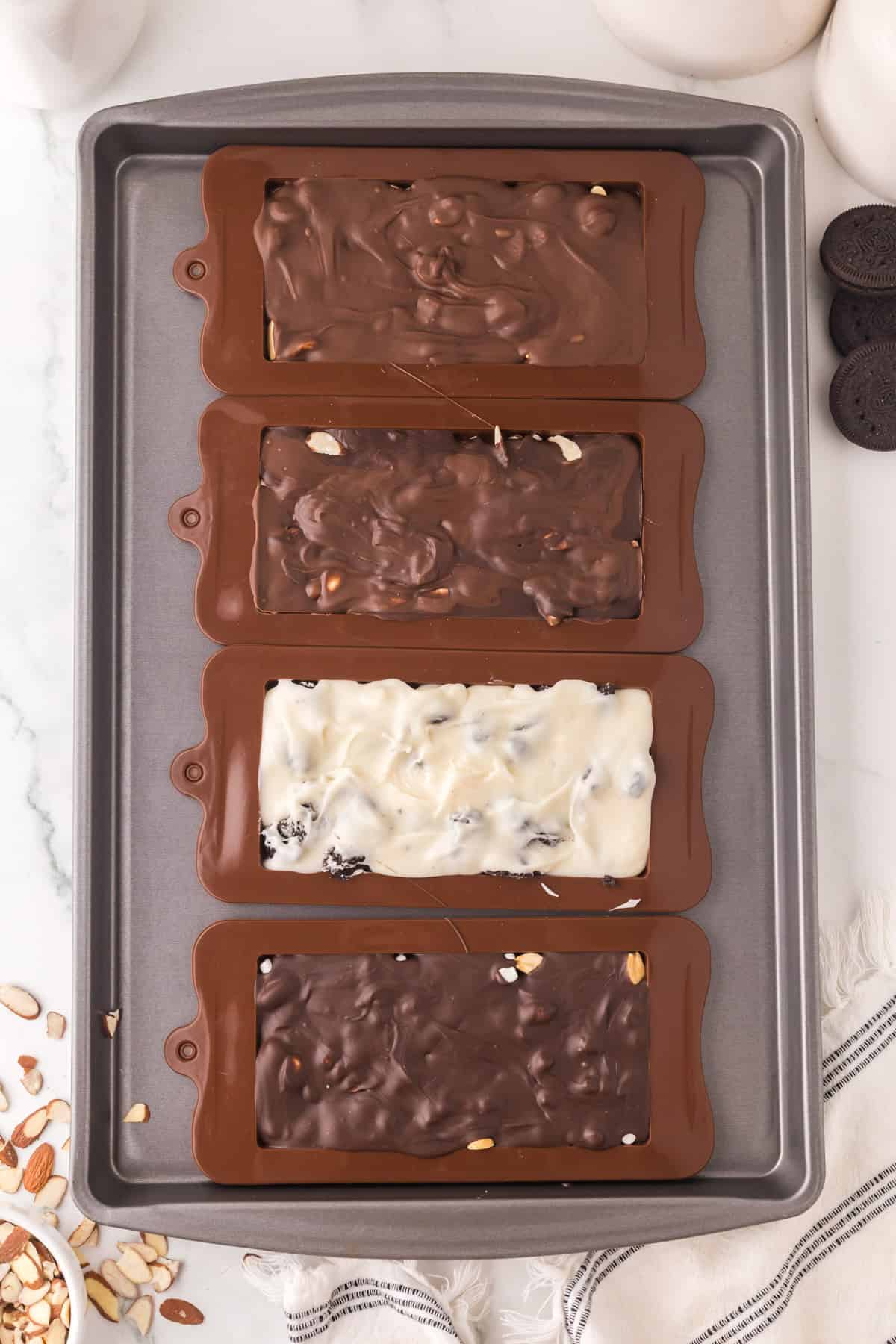 melted chocolate in molds to make homemade candy bars.