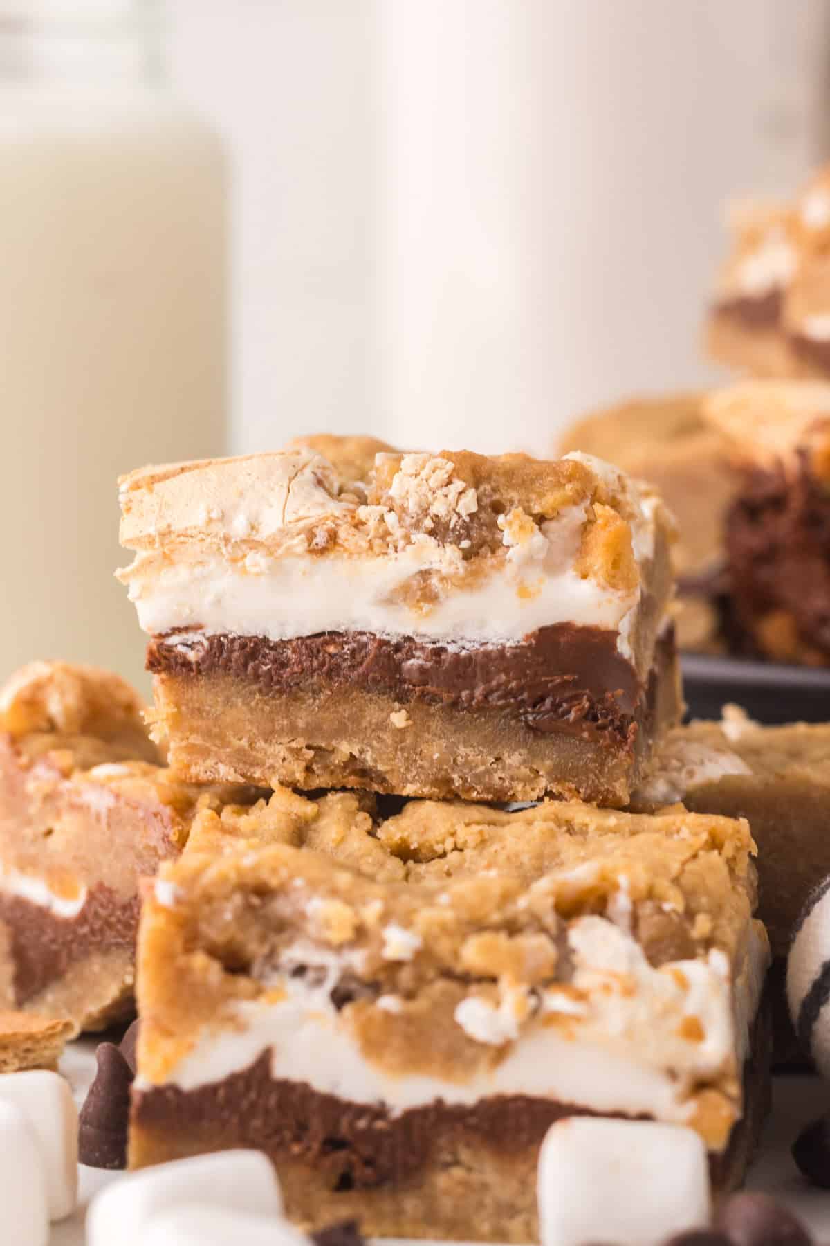 square portions of nutella s'mores bars in a stack on the counter.