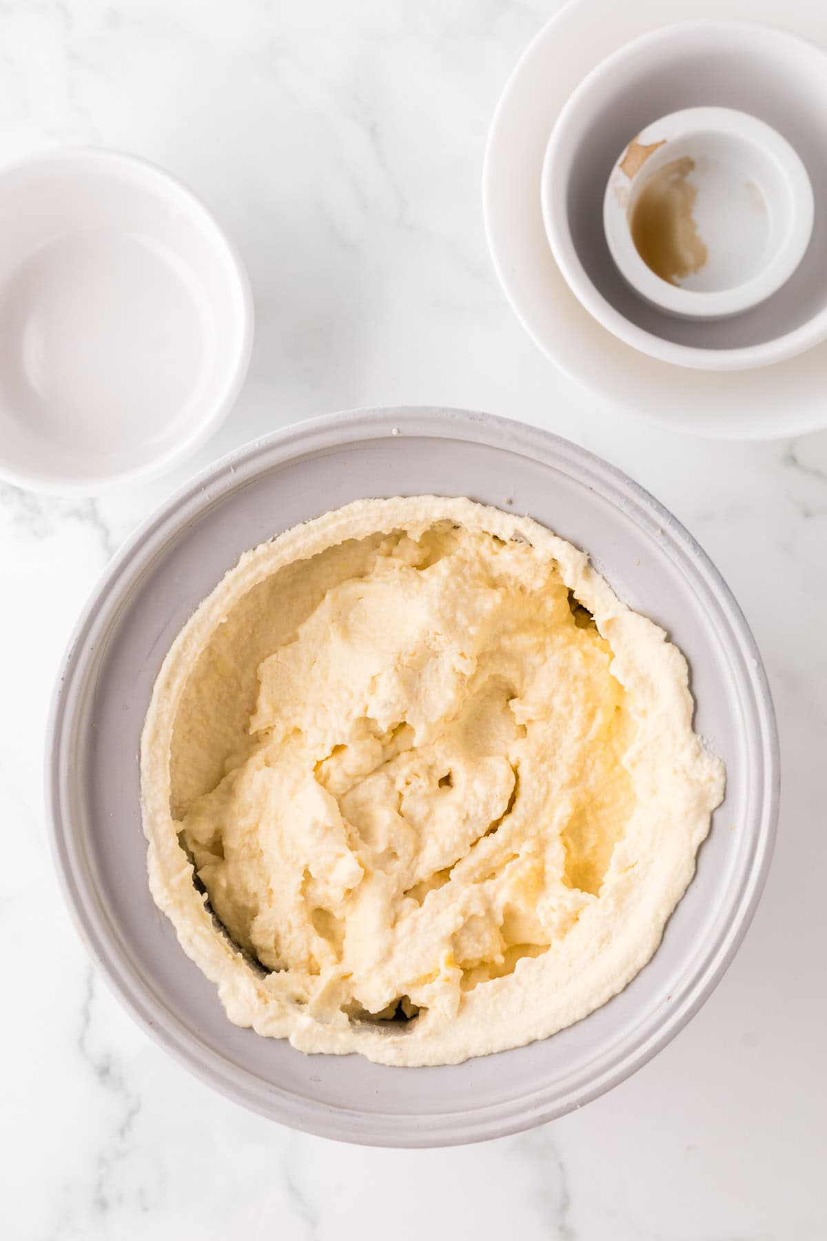 cold ice cream maker in the process to make peach ice cream.