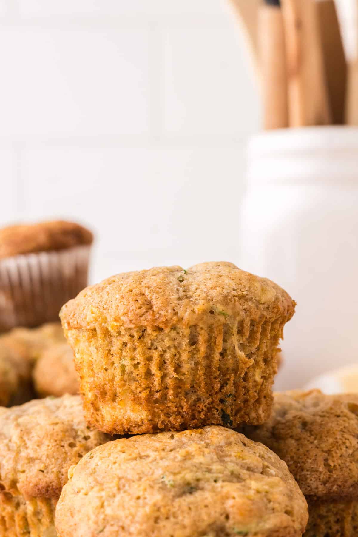 pineapple zucchini muffins in a pile.