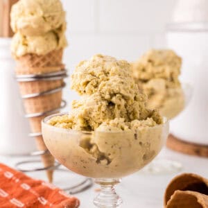 pistachio gelato in a steamed fancy glass dish.