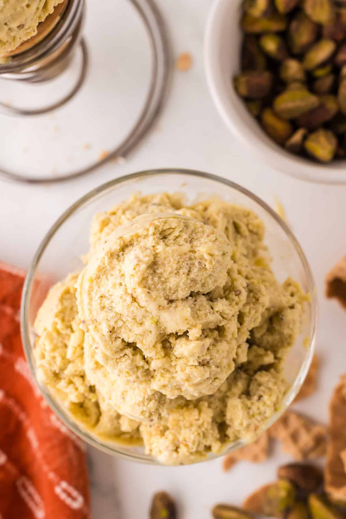 pistachio gelato in a steamed fancy glass dish.