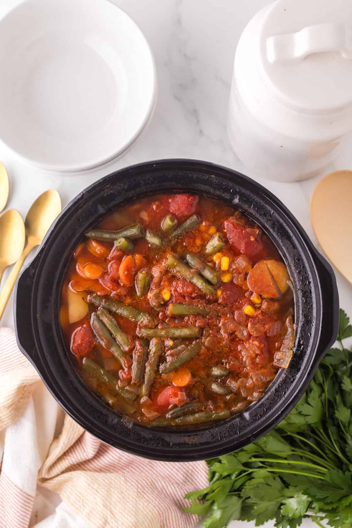 slow cooker beef veggie soup in progress.