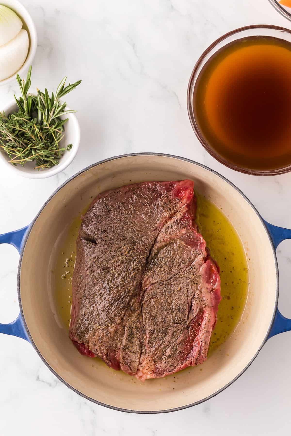 slow cooker pot roast in a pan.