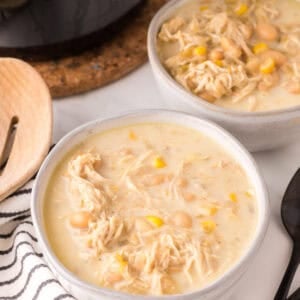 white chicken chili in white serving bowls.