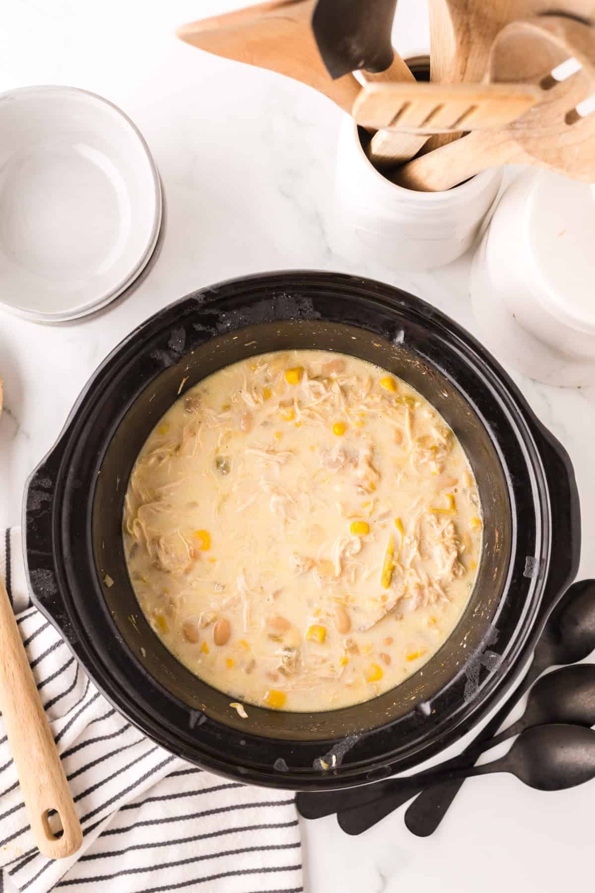 crock pot with white chicken chili recipe inside.