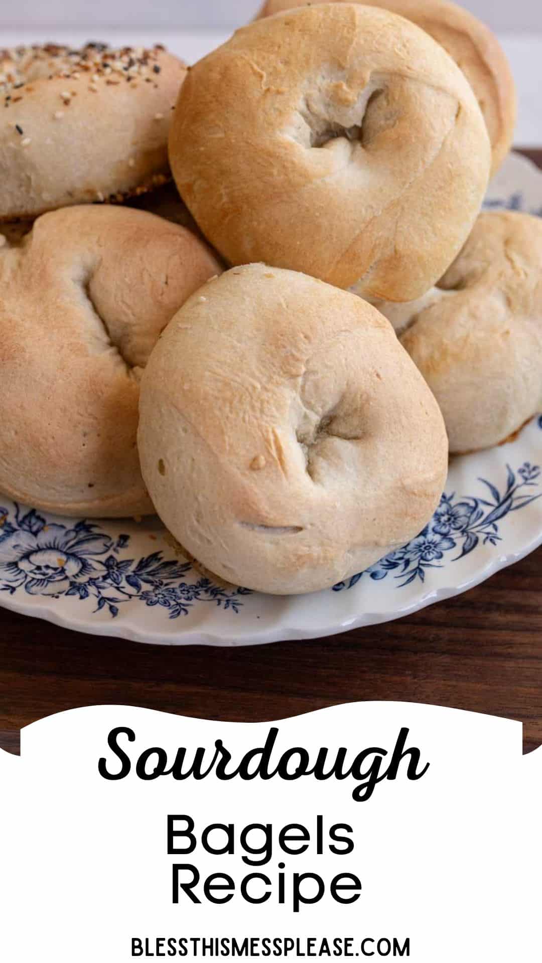 bagels piled on a blue and white plate with words sourdough bagels recipe.