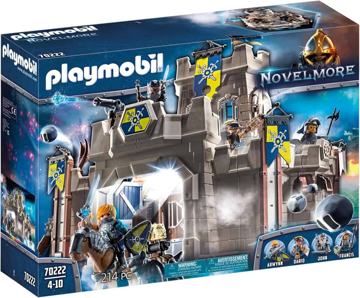 Playmobil Novelmore toy set featuring a medieval castle with knights. The box shows images of knights in armor and various accessories, with details like windows, flags, and a drawbridge. Suitable for ages 4-10, containing 214 pieces.