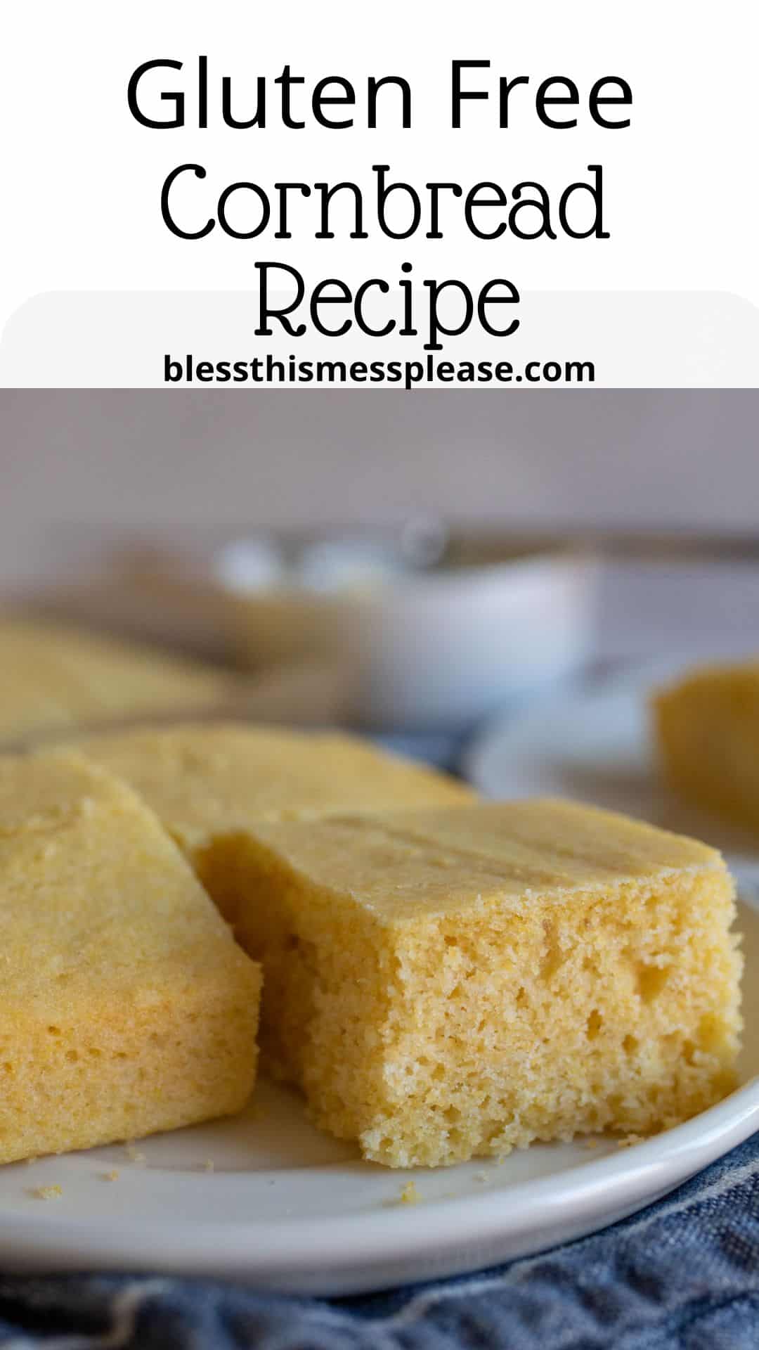 Close-up of sliced gluten-free cornbread on a white plate. Background features a blurred view of a small bowl and a fork. Text above the image reads: Gluten Free Cornbread Recipe with a website URL.