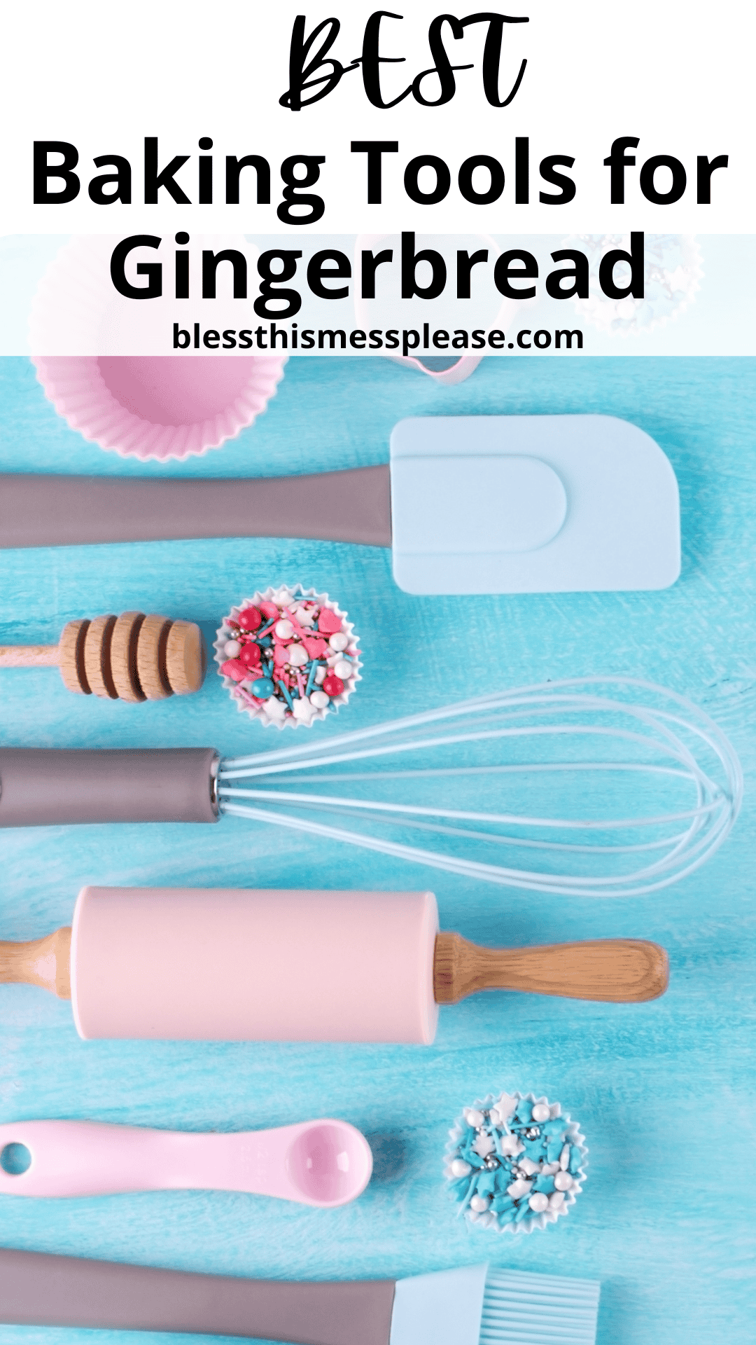 A flat lay of the best baking tools for gingerbread on a light blue surface, featuring a pink rolling pin, whisk, blue spatula, pastry brush, and honey dipper. Cupcake liners and decorative sprinkles in pink and blue are artfully scattered around.