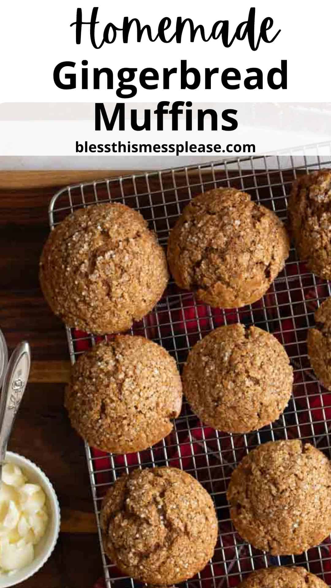 A batch of homemade gingerbread muffins cooling on a wire rack. A small dish with butter and two spoons is placed beside the rack. The image features the text Homemade Gingerbread Muffins and blessthismessplease.com at the top.