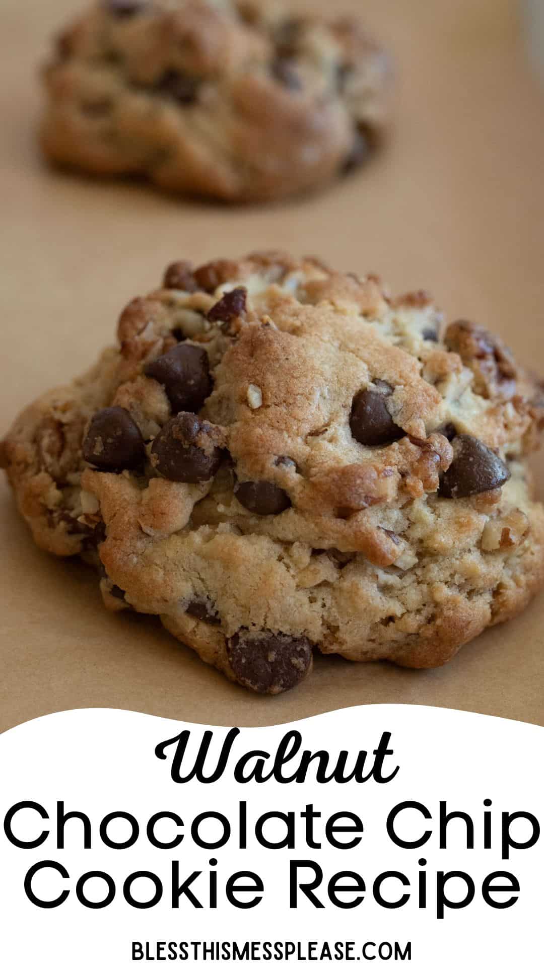 A close-up of a walnut chocolate chip cookie resting on a brown surface. The cookie is thick, golden brown, and studded with chocolate chips and walnut pieces. Text below reads: Walnut Chocolate Chip Cookie Recipe, blessthismessplease.com.