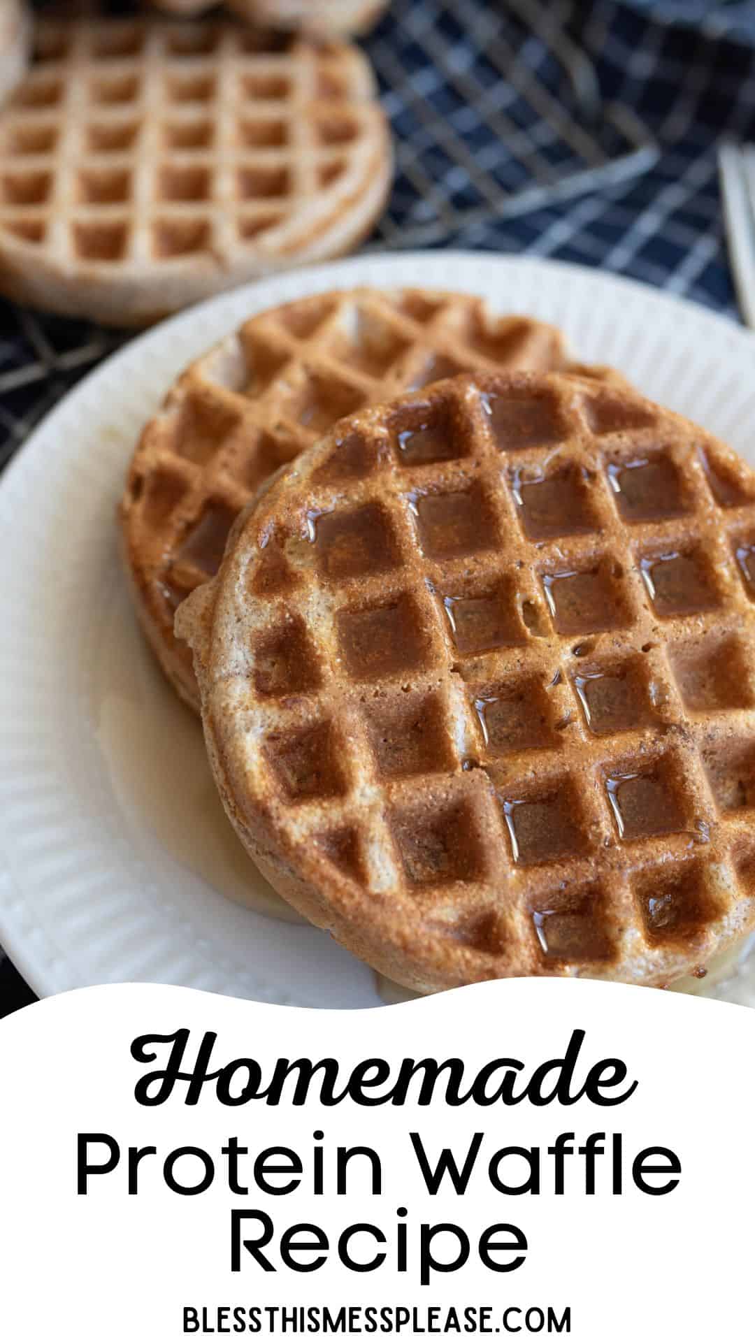 Close-up of two round, golden-brown homemade waffles with syrup on a white plate. The background shows more waffles on a checkered tablecloth. Text at the bottom reads, Homemade Protein Waffle Recipe blessthismessplease.com.