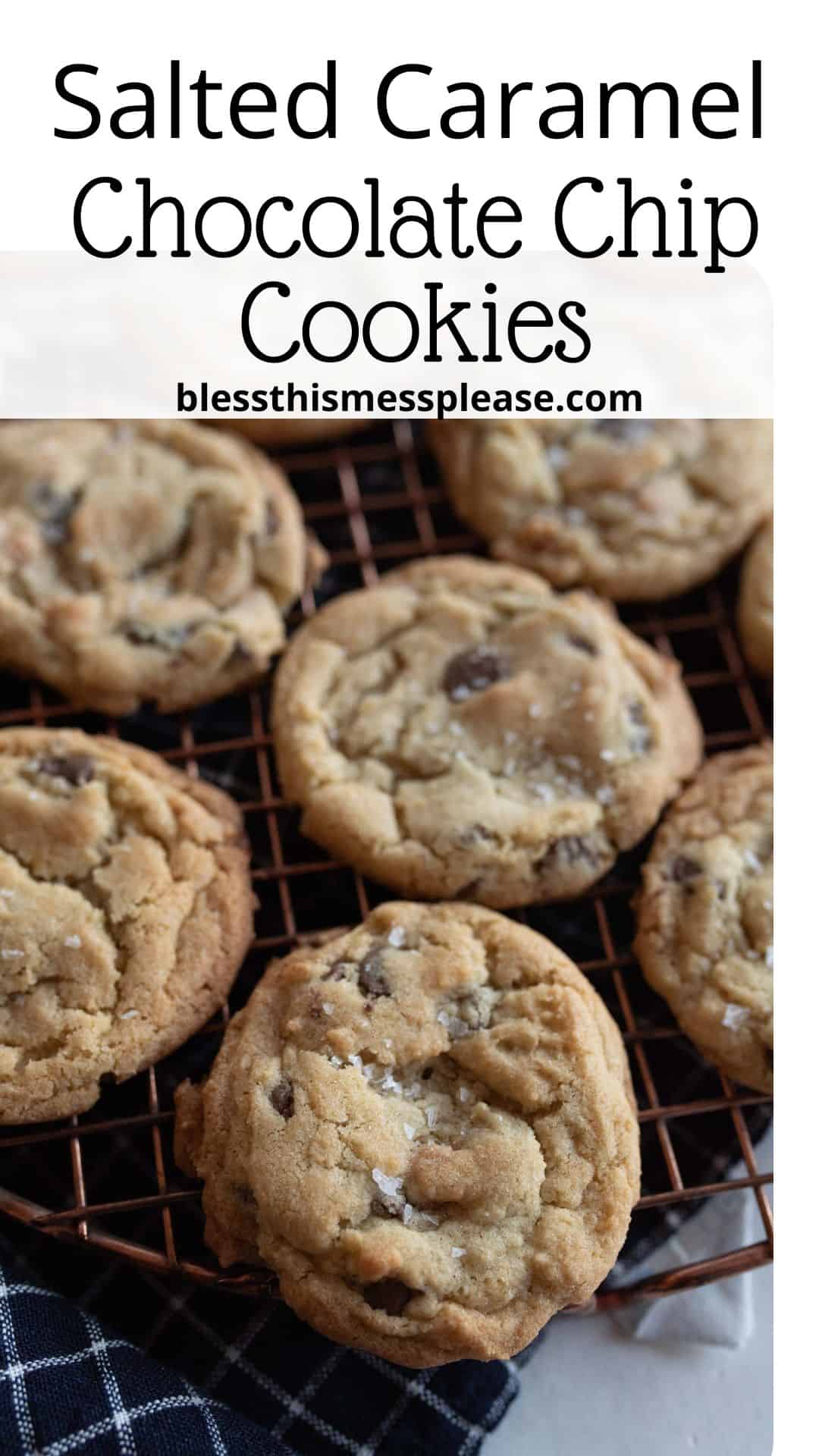 Close-up of salted caramel chocolate chip cookies cooling on a wire rack. The cookies are golden-brown with visible chocolate chips and a sprinkle of salt on top, placed on a checkered cloth.